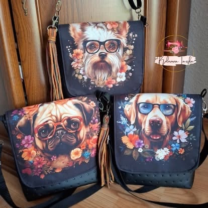 Three dog-themed crossbody bags displayed with illustrated dogs wearing sunglasses surrounded by colorful flowers